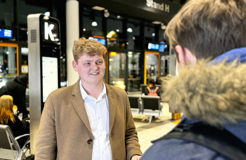 Luke at Durham's new bus station speaking with commuter about the new Government funding to improve connectivity