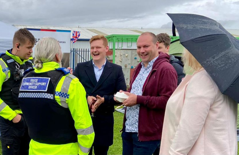 Luke Allan Holmes and Andy Jackson speaking with local PCSOs at a community event