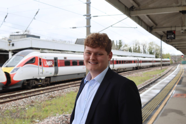 Luke at Durham train station with LNER Azuma in the platform