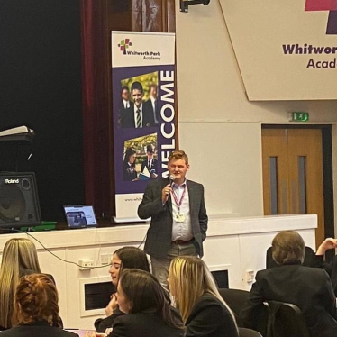 Luke speaking with students at Whitworth Park Academy