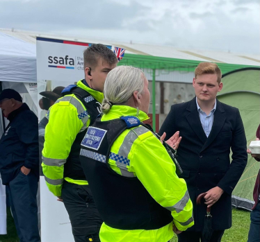 Luke speaking with local police officers